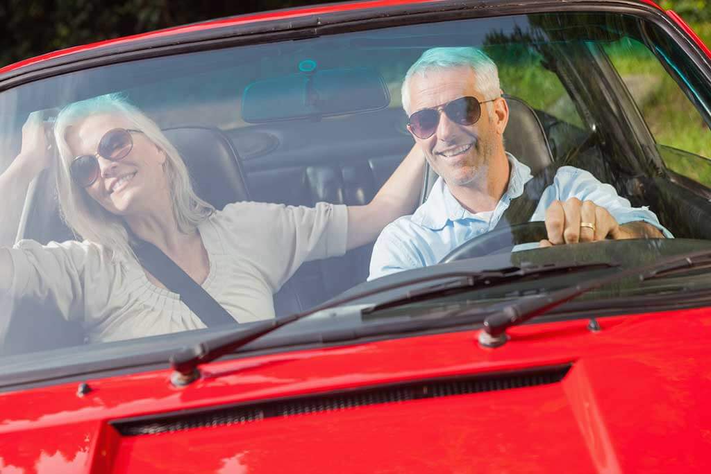 A couple with hearing loss out for a drive. 